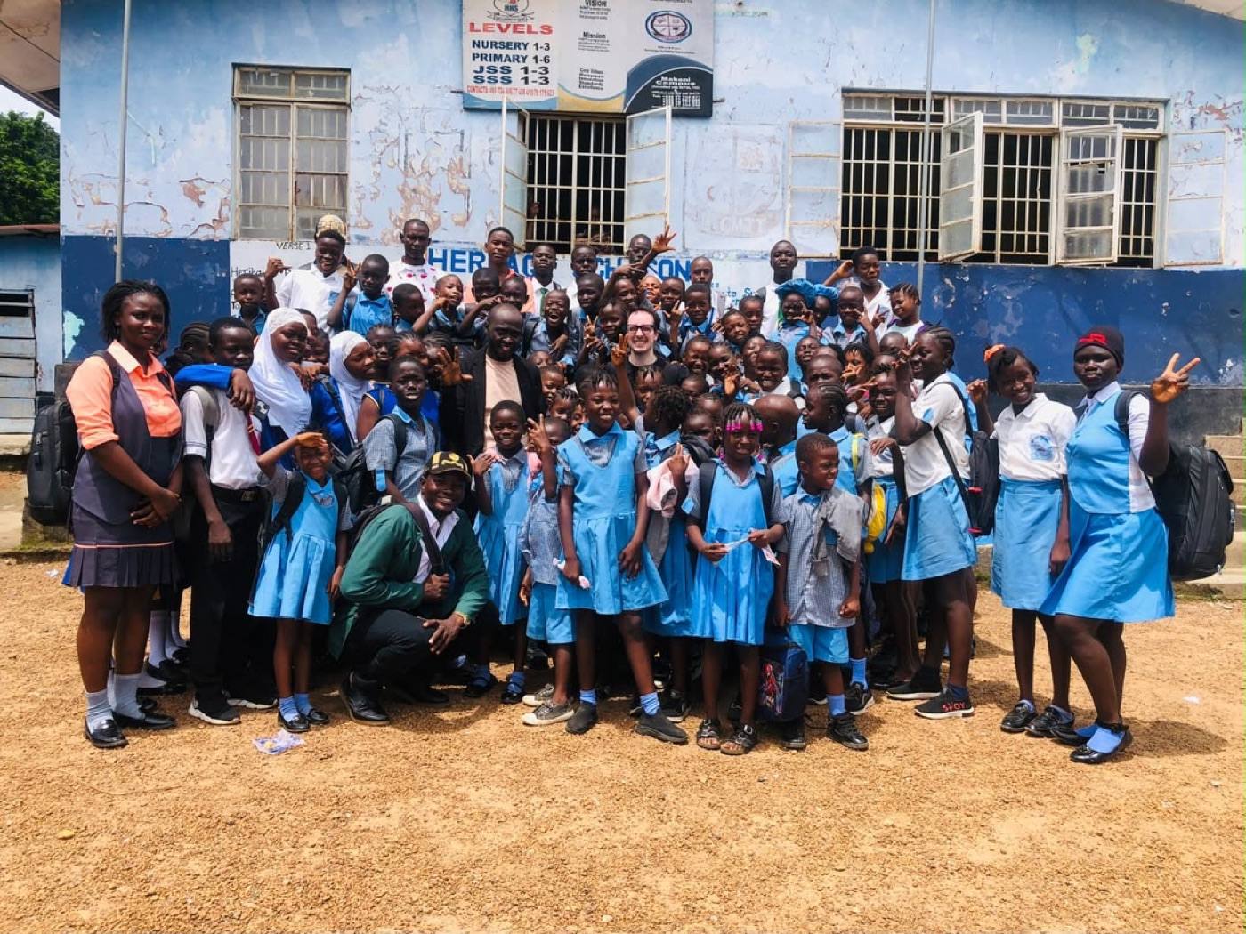 The Capyo team with students and teachers in front of Heritage Academy in Makeni, Sierra Leone